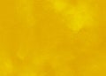 Yellow ocherous abstract textured background texture to the point with bright spots of paint. Blank background design banner.