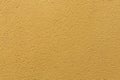 Yellow ochre painted stucco wall. Background texture Royalty Free Stock Photo