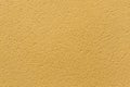 Yellow ochre painted stucco wall. Background texture Royalty Free Stock Photo