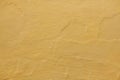 Yellow ochre painted stucco wall. Background texture Royalty Free Stock Photo