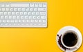 Yellow office desk. with a white desktop keThe most popular workspace theme background.