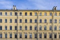 Yellow old building facade with many windows Royalty Free Stock Photo