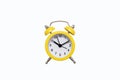 Yellow old-fashioned alarm clock with a dial on a white background with free space for text Royalty Free Stock Photo