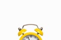 Yellow old-fashioned alarm clock with a dial on a white background with free space for text Royalty Free Stock Photo