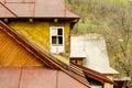 Yellow old fashioned wooden building with white window and with Royalty Free Stock Photo