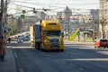 yellow old Freightliner truck moving on central street of Tula, Russia