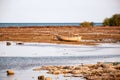 The yellow and old wooden boat in neap tide with warm light period Royalty Free Stock Photo