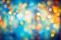 Yellow and orange blurred lights with bokeh effect. Colorful festive bokeh in New Year or Christmas style, concept background. Royalty Free Stock Photo