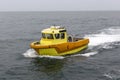 Yellow orange boat engine and sparkling sea water formed by sea surface Royalty Free Stock Photo