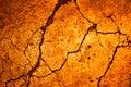 Yellow orange broken concrete wall of an old building with cracks. Close-up. Background. Royalty Free Stock Photo