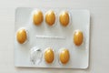Yellow or orange capsule pill medicine on white background. Pharmaceuticals antibiotics pills medicine
