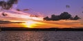 Yellow orange colored stratus cumulus cloud, sunset seascape.