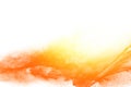 Yellow orange dust particles explosion on white background. Royalty Free Stock Photo