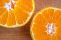 Bright and yellow orange.two halves of tangerine Royalty Free Stock Photo