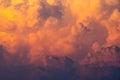 Yellow, orange fluffy clouds on sunset sky background. Art picture of orange clouds texture. Beautiful pattern of clouds. Freedom