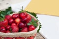 Fresh cherries and red ripe strawberries on a white plate Royalty Free Stock Photo