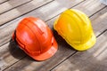 Yellow, orange hard safety helmet construction hat for safety pr Royalty Free Stock Photo