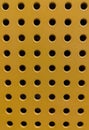 Yellow, orange iron perforated sheet.