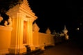 A yellow orange lit wall and doorway at night in Phnom Penh Cambodia, South East Asia