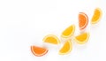 Yellow and orange marmalade candy on white background