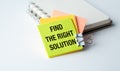 A yellow, orange and pink piece of paper with the words Find the right solution written on it Royalty Free Stock Photo