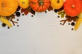 Yellow and orange pumpkins and corn with autumn decor on white wooden background for harvest fall and thanksgiving theme. cornucop Royalty Free Stock Photo