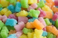 Many multicolored jelly gummy bears.