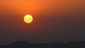 A yellow orange sunset at the desert. Al Medina Al Munawarah, Hail, Saudi Arabia. Royalty Free Stock Photo