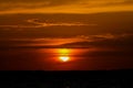 Solar eclipse at sunset across the sky above the sea Royalty Free Stock Photo