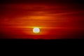 Solar eclipse at sunset across the sky above the sea Royalty Free Stock Photo