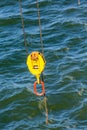 Yellow and Orange Turnbuckle Over Sea Royalty Free Stock Photo