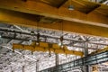 Yellow overhead crane. Jib crab trolley with hooks. Royalty Free Stock Photo