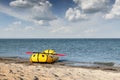 Yellow packraft rubber boat with red padle