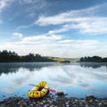 Yellow packraft rubber boat with red padle