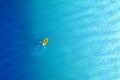 Yellow packraft rubber boat and turquoise water