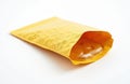 Yellow padded envelope open slightly revealing clear bubble lining inside. Shipping mailer object for protecting fragile items Royalty Free Stock Photo