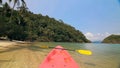 Yellow paddle on pink canoe standing on sand beach Royalty Free Stock Photo