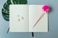 Yellow page notebook with pink pen and shell Royalty Free Stock Photo