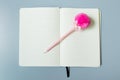 Yellow page notebook with pink pen Royalty Free Stock Photo