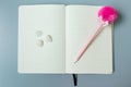 Yellow page notebook with pink pen and shell Royalty Free Stock Photo