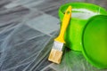 Yellow paint brush and green bucket Royalty Free Stock Photo