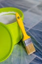 Yellow paint brush and green bucket Royalty Free Stock Photo