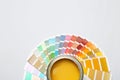 Yellow paint can and color palette on white, top view. Space for text Royalty Free Stock Photo