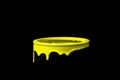 Yellow paint flowing down on wall of metal bucket. Isolated over black background Royalty Free Stock Photo