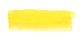 Yellow paint stroke drawn with brush on white background, top view Royalty Free Stock Photo