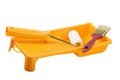 Yellow paint tray with foam roller and paintbrush Royalty Free Stock Photo