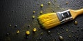 Yellow paintbrush on dark surface with spilled paint. Generative AI Royalty Free Stock Photo