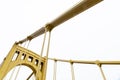 Yellow painted bridge upright and suspension supports Royalty Free Stock Photo