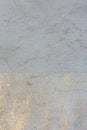 Yellow painted concrete wall background texture. Old grunge uneven surface with scratches and cracks. Rough plaster Royalty Free Stock Photo