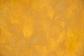 Yellow painted concrete wall surface background texture close up Royalty Free Stock Photo
